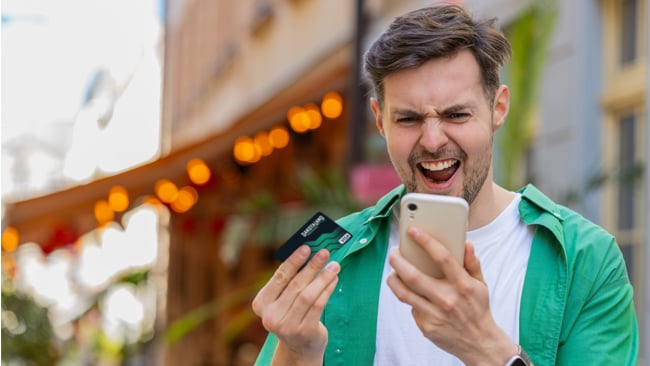 Overdraft Protection Image of Guy Holding Card Overdraft Protection Image of Guy Holding Card