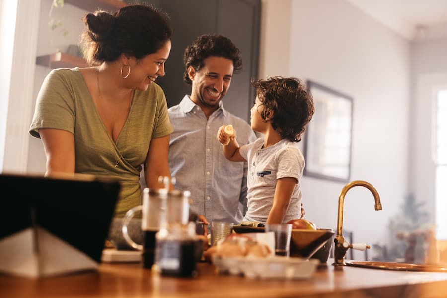 A family spends time together in their kitchen.
