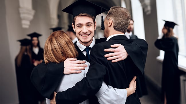 Family Embracing After Graduation