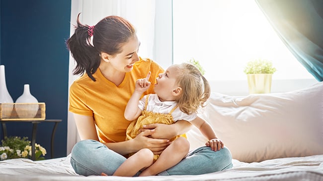 Mother Sitting with Toddler Daughter